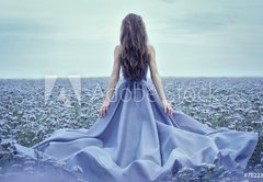 Fototapeta145 x 100  Back view of standing young woman in blue dress, 145 x 100 cm