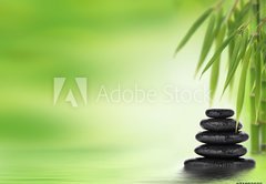 Fototapeta174 x 120  Spa background with stacked massage stones and bamboo, 174 x 120 cm