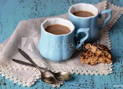 Samolepka flie 100 x 73  Cups of coffee with cookies and napkin on wooden table, 100 x 73 cm