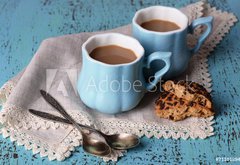 Fototapeta pltno 174 x 120, 71101894 - Cups of coffee with cookies and napkin on wooden table