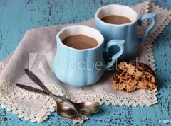 Fototapeta330 x 244  Cups of coffee with cookies and napkin on wooden table, 330 x 244 cm