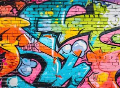 Fototapeta papír 360 x 266, 715124495 - wall scratched with colorful graffiti and drawings. colorful graffiti brick wall urban visual