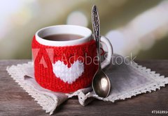 Fototapeta papr 184 x 128, 71618914 - Cup of tasty hot tea, on wooden table, on light background