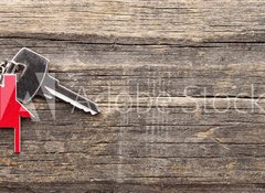 Fototapeta100 x 73  Symbol of the house with silver key on vintage wooden background, 100 x 73 cm