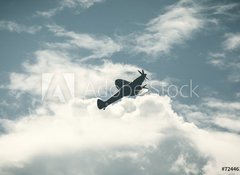 Fototapeta100 x 73  Fighter plane on cloudy sky, 100 x 73 cm