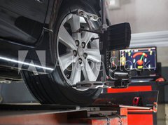 Fototapeta vliesov 270 x 200, 74461674 - Car on stand with sensors on wheels for wheels alignment camber