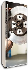 Samolepka na lednici flie 80 x 200, 76464248 - Focused mechanic adjusting the wheel