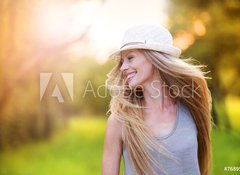 Fototapeta100 x 73  Beautiful woman outside in a park., 100 x 73 cm