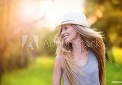 Fototapeta papr 184 x 128, 76895615 - Beautiful woman outside in a park.