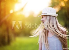Samolepka flie 100 x 73, 76895650 - Beautiful woman outside in a park.