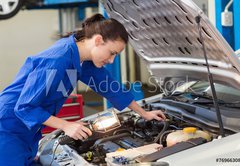 Fototapeta pltno 174 x 120, 76966308 - Mechanic examining under hood of car with torch