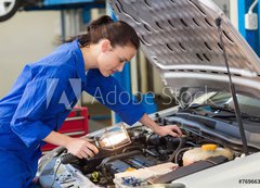 Fototapeta vliesov 200 x 144, 76966308 - Mechanic examining under hood of car with torch