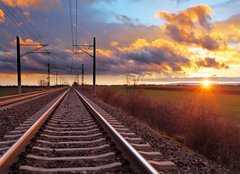 Fototapeta160 x 116  Orange sunset in low clouds over railroad, 160 x 116 cm