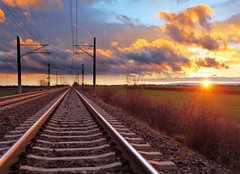 Fototapeta papr 254 x 184, 81148616 - Orange sunset in low clouds over railroad - Oranov zpad slunce v nzkch mracch nad eleznic