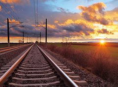 Fototapeta360 x 266  Orange sunset in low clouds over railroad, 360 x 266 cm