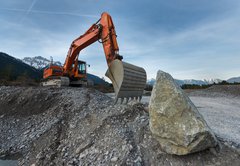 Fototapeta145 x 100  huge shovel excavator standing on gravel hill with stone rock, 145 x 100 cm