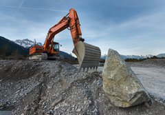 Fototapeta184 x 128  huge shovel excavator standing on gravel hill with stone rock, 184 x 128 cm