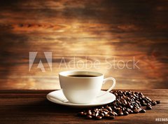 Fototapeta pltno 330 x 244, 81865478 - Cup of coffee with grains on wooden background