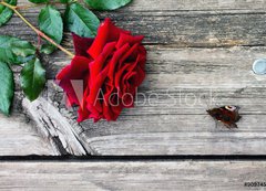 Samolepka flie 200 x 144  Red rose and butterfly on an old wooden table, 200 x 144 cm