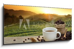 Skleněný obraz 1D panorama - 120 x 50 cm F_AB125680313 - Hot Coffee cup with Coffee beans on the wooden table and the pla - Horký šálek kávy s kávová zrna na dřevěný stůl a pla