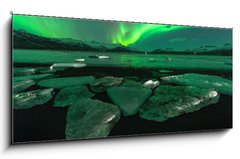 Sklenn obraz 1D panorama - 120 x 50 cm F_AB209731470 - A beautiful green and red aurora dancing over the Jokulsarlon lagoon, Iceland