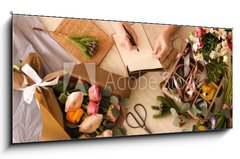Obraz 1D panorama - 120 x 50 cm F_AB266667837 - Florist writing in notebook at table