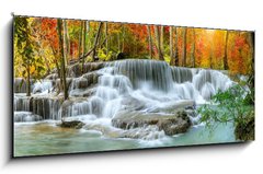 Skleněný obraz 1D panorama - 120 x 50 cm F_AB296784817 - Colorful majestic waterfall in national park forest during autumn, panorama