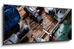 Sklenn obraz 1D panorama - 120 x 50 cm F_AB321607758 - Power Tools On Wooden Desk