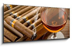 Sklenn obraz 1D panorama - 120 x 50 cm F_AB34951476 - cuban cigar and cognac on wood background - kubnsk doutnk a koak na devnm pozad