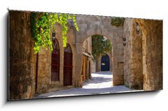 Sklenn obraz 1D panorama - 120 x 50 cm F_AB43877162 - Medieval arched street in the old town of Rhodes, Greece