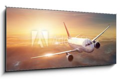 Skleněný obraz 1D - 120 x 50 cm F_AB44261036 - Airplane in the sky at sunset - Letadlo na obloze při západu slunce