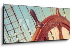 Sklenn obraz 1D panorama - 120 x 50 cm F_AB68023359 - Steering wheel of old sailing vessel