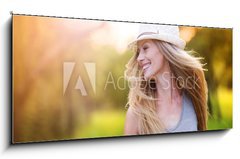 Obraz 1D panorama - 120 x 50 cm F_AB76895615 - Beautiful woman outside in a park.