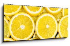 Skleněný obraz 1D panorama - 120 x 50 cm F_AB79134389 - Lemon slices background - Lemon plátky pozadí