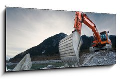 Obraz 1D panorama - 120 x 50 cm F_AB81423741 - heavy organge excavator with shovel standing on hill with rocks