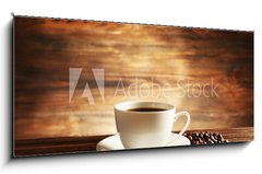 Obraz 1D panorama - 120 x 50 cm F_AB81865478 - Cup of coffee with grains on wooden background