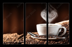 Obraz 3D tdln - 105 x 70 cm F_BB286399259 - White Cup Of Hot Coffee With Heart Shaped Steam On Old Weathered Table With Burlap Sack And Beans