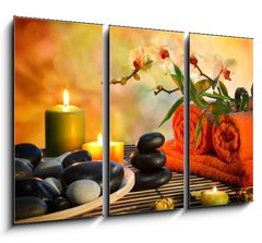 Obraz   preparation for massage in orange lights and black stones, 105 x 70 cm
