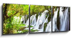 Obraz 3D tdln - 150 x 50 cm F_BM107722539 - Scenic waterfall with crystal clear water among green forest