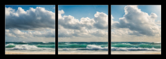 Obraz 3D třídílný - 150 x 50 cm F_BM629716136 - Ocean coast panorama in calm weather with small waves, blue sky, white clouds and bright sun. Seascape illustration. Generative AI