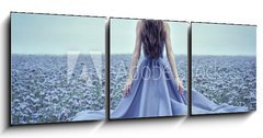 Obraz   Back view of standing young woman in blue dress, 150 x 50 cm