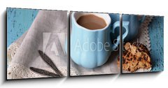 Obraz 3D třídílný - 150 x 50 cm F_BM71101894 - Cups of coffee with cookies and napkin on wooden table - Šálek kávy s cookies a ubrousek na dřevěném stole