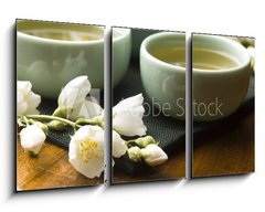 Obraz 3D tdln - 90 x 50 cm F_BS42047983 - Green tea with jasmine in cup and teapot on wooden table - Zelen aj s jasmnem v lku a konvici na devnm stole