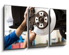 Obraz 3D tdln - 90 x 50 cm F_BS76464248 - Focused mechanic adjusting the wheel