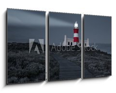 Obraz   Lighthouse with shining light in darkness and dark blue clouds a, 90 x 50 cm