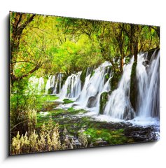 Obraz 1D - 100 x 70 cm F_E107722539 - Scenic waterfall with crystal clear water among green forest