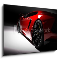 Obraz   Red fast sports car in spotlight, black background. Shiny, new, luxurious., 100 x 70 cm