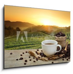 Obraz 1D - 100 x 70 cm F_E125680313 - Hot Coffee cup with Coffee beans on the wooden table and the pla