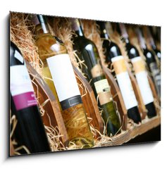 Obraz 1D - 100 x 70 cm F_E20727251 - Closeup shot of wineshelf. Bottles lay over straw. - Detailn zbr z vinrny. Lhve leely pes slmu.
