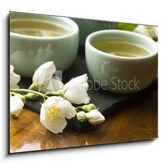 Sklenn obraz 1D - 100 x 70 cm F_E42047983 - Green tea with jasmine in cup and teapot on wooden table - Zelen aj s jasmnem v lku a konvici na devnm stole